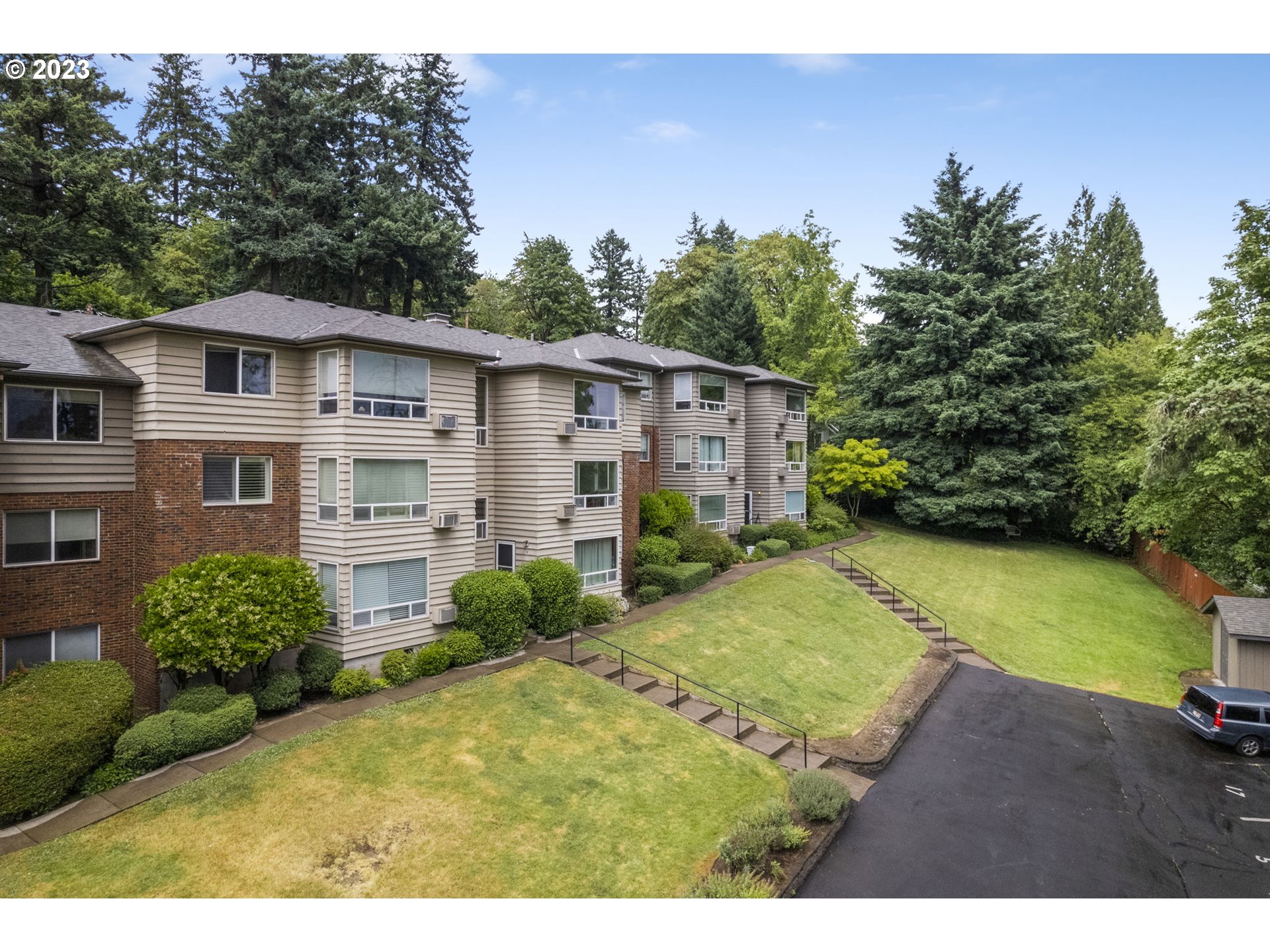 8400 Southwest Canyon Lane, Unit 6 Portland, OR 97225 - Photo 1 of 19 a view of a house with a backyard