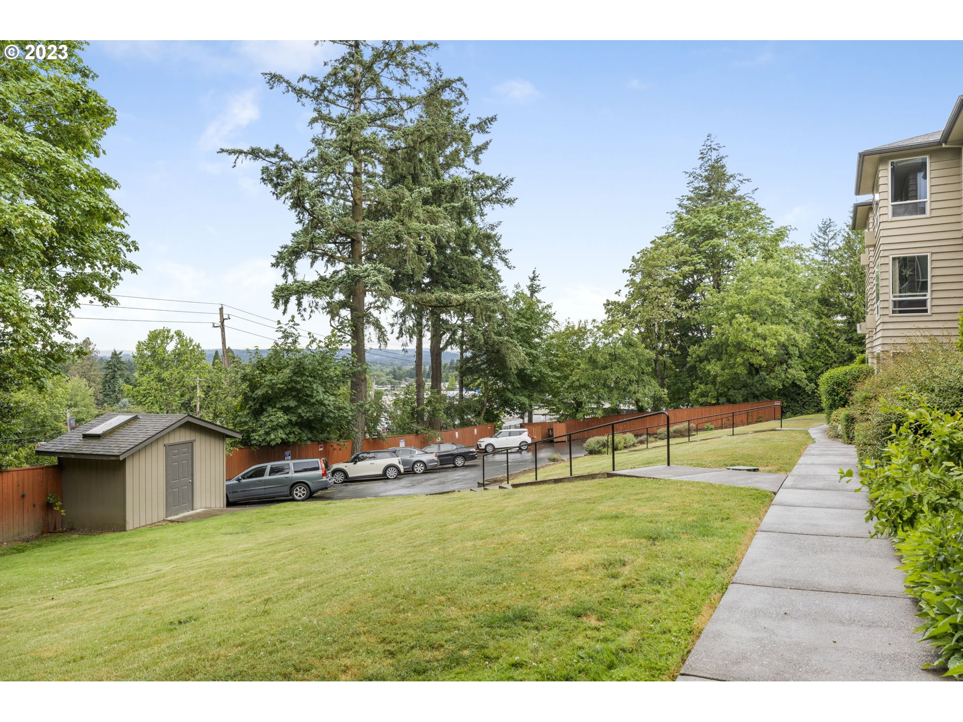 8400 Southwest Canyon Lane, Unit 6 Portland, OR 97225 - Photo 18 of 19 a view of a house with a yard porch and sitting area