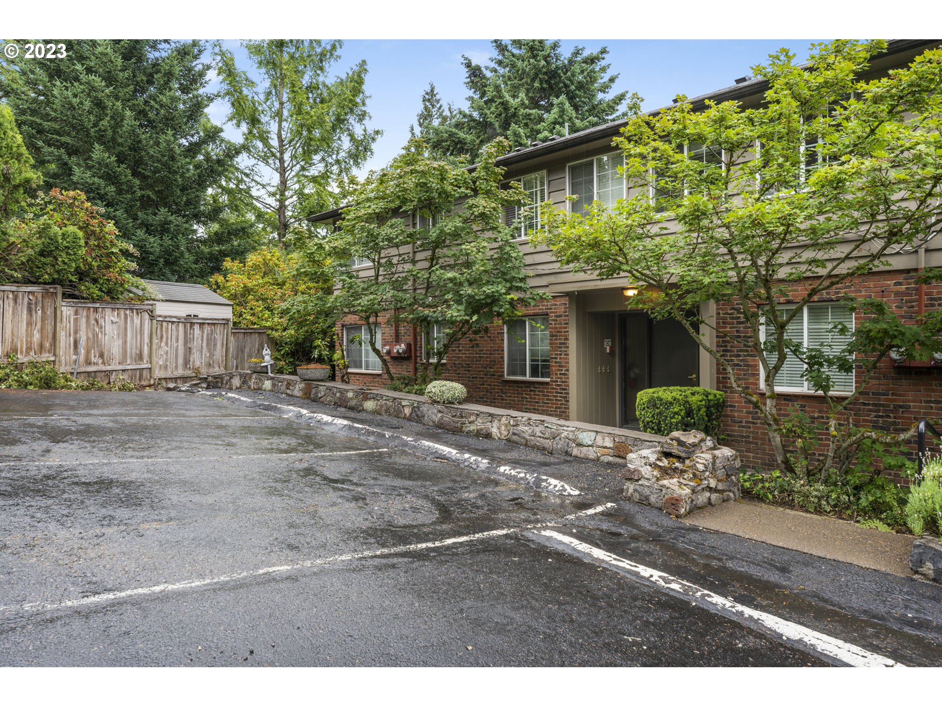 8400 Southwest Canyon Lane, Unit 6 Portland, OR 97225 - Photo 19 of 19 a front view of a house with garden