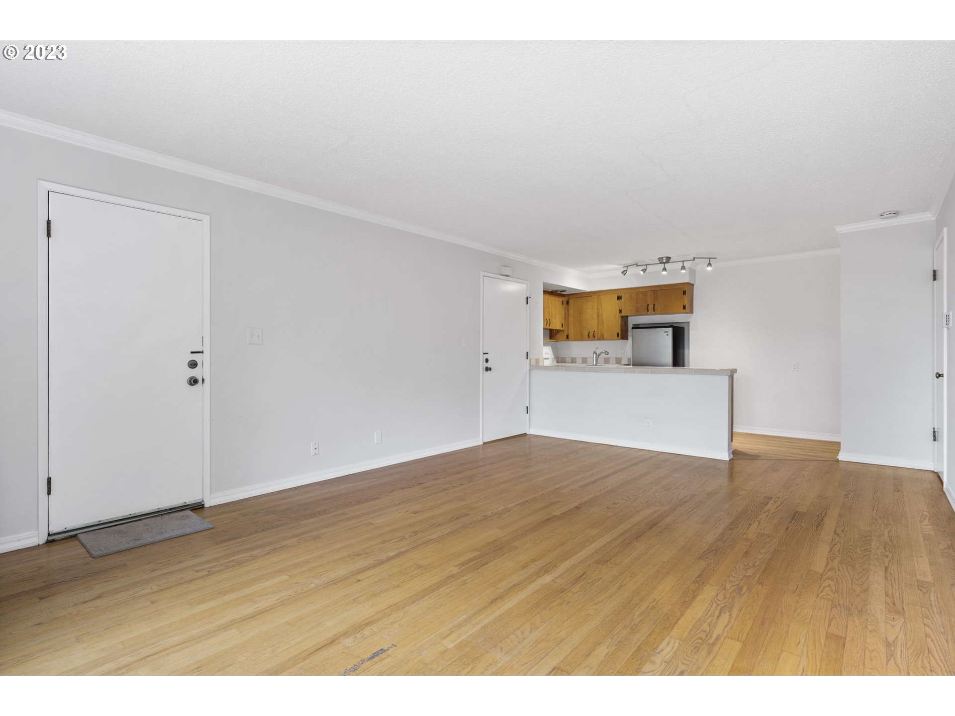 8400 Southwest Canyon Lane, Unit 6 Portland, OR 97225 - Photo 7 of 19 a view of an empty room and wooden floor