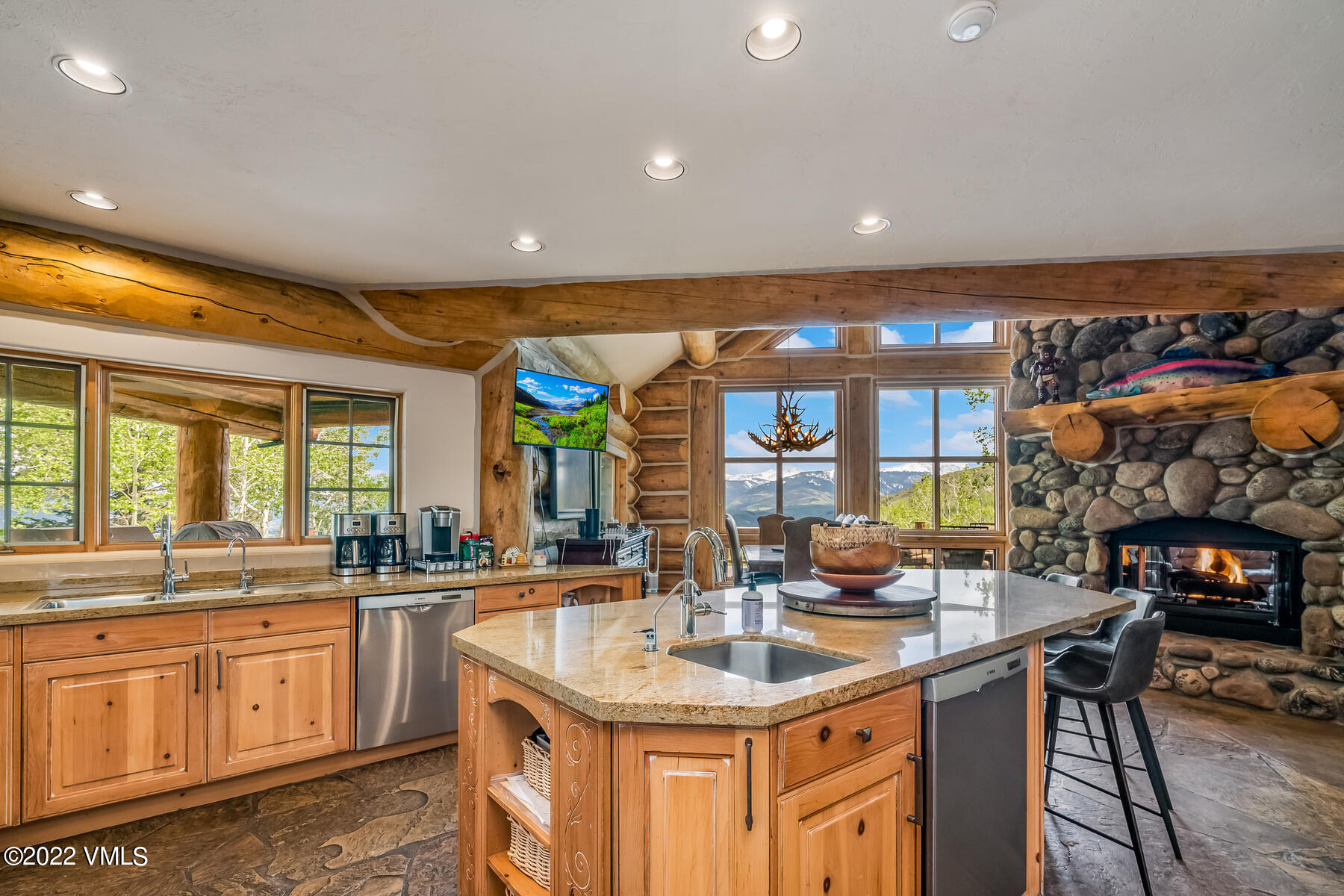 4000 Bellyache Ridge Road Wolcott, CO 81655 - Photo 13 of 56 a kitchen with stainless steel appliances granite countertop a sink and a wooden floors