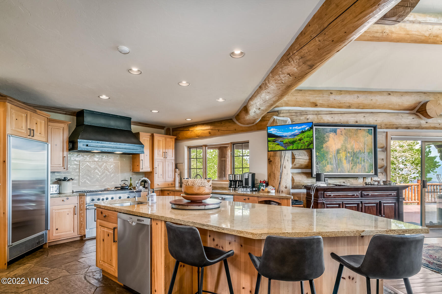 4000 Bellyache Ridge Road Wolcott, CO 81655 - Photo 15 of 56 a kitchen with stainless steel appliances granite countertop table chairs sink and cabinets