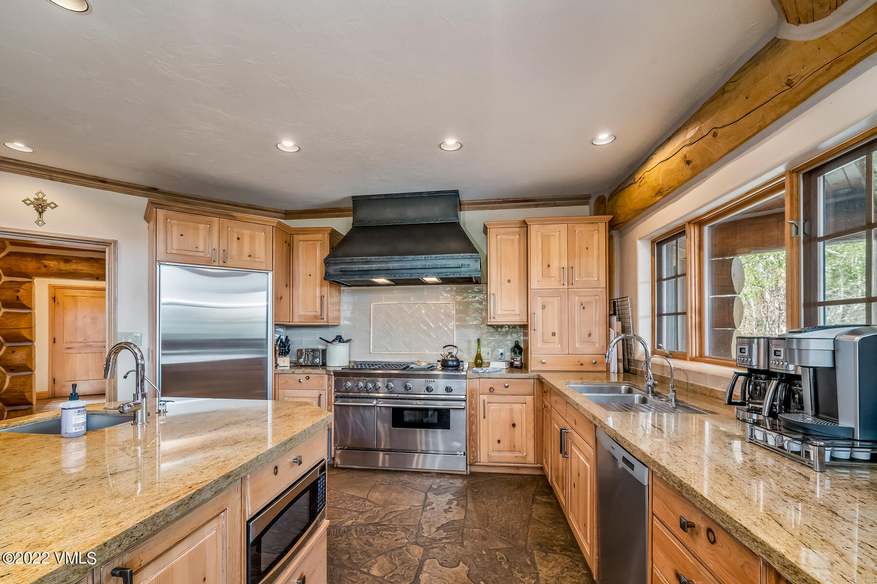 4000 Bellyache Ridge Road Wolcott, CO 81655 - Photo 17 of 56 a large kitchen with stainless steel appliances granite countertop a sink stove and refrigerator