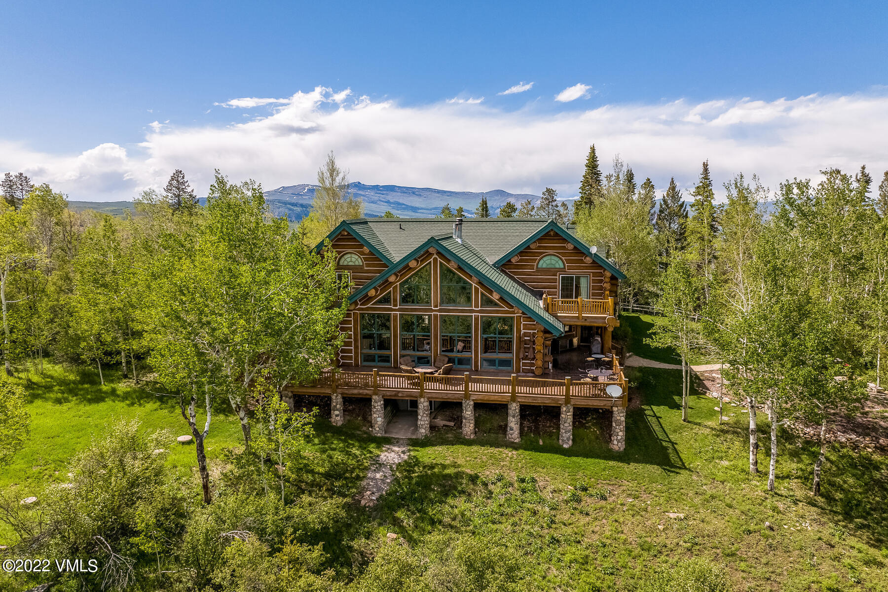 4000 Bellyache Ridge Road Wolcott, CO 81655 - Photo 2 of 56 a view of a big house with a big yard and large trees