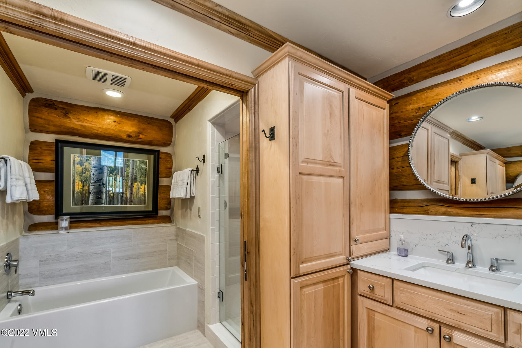 4000 Bellyache Ridge Road Wolcott, CO 81655 - Photo 26 of 56 a bathroom with a sink mirror vanity and bathtub