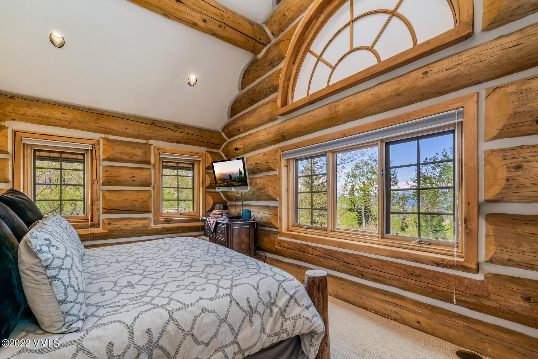 4000 Bellyache Ridge Road Wolcott, CO 81655 - Photo 27 of 56 a bedroom with a bed a dresser next to a large window