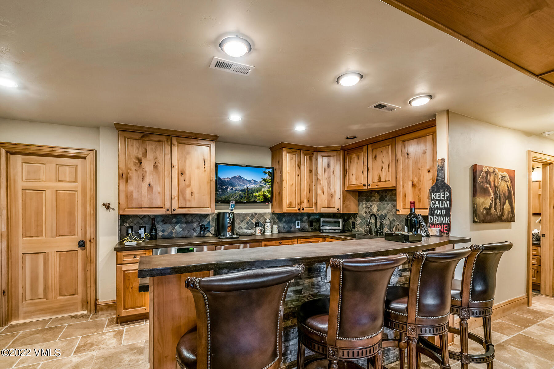 4000 Bellyache Ridge Road Wolcott, CO 81655 - Photo 35 of 56 a kitchen with a table chairs sink and cabinets