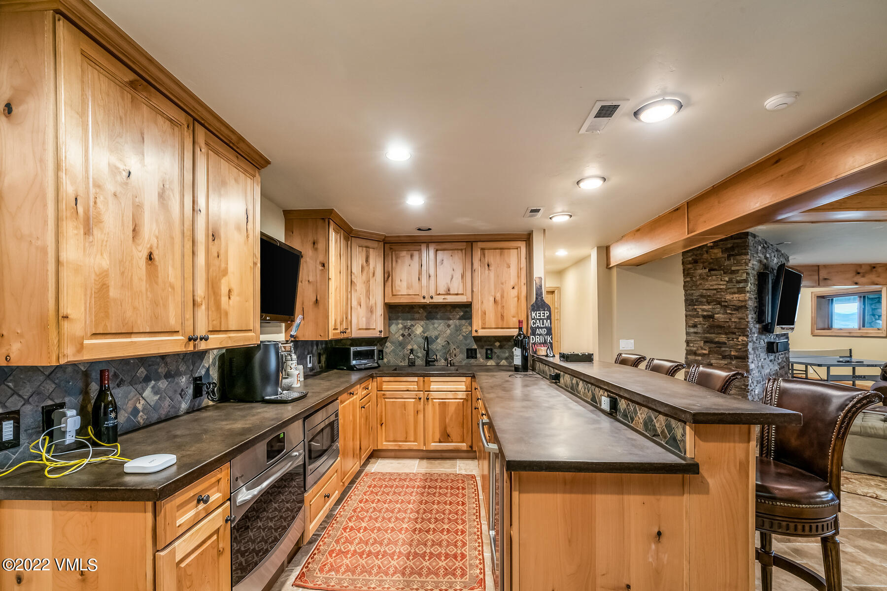 4000 Bellyache Ridge Road Wolcott, CO 81655 - Photo 36 of 56 a kitchen with stainless steel appliances granite countertop a sink stove and cabinets