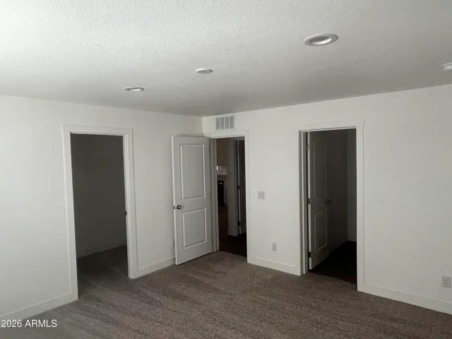 a bathroom with 2 sink and a mirror