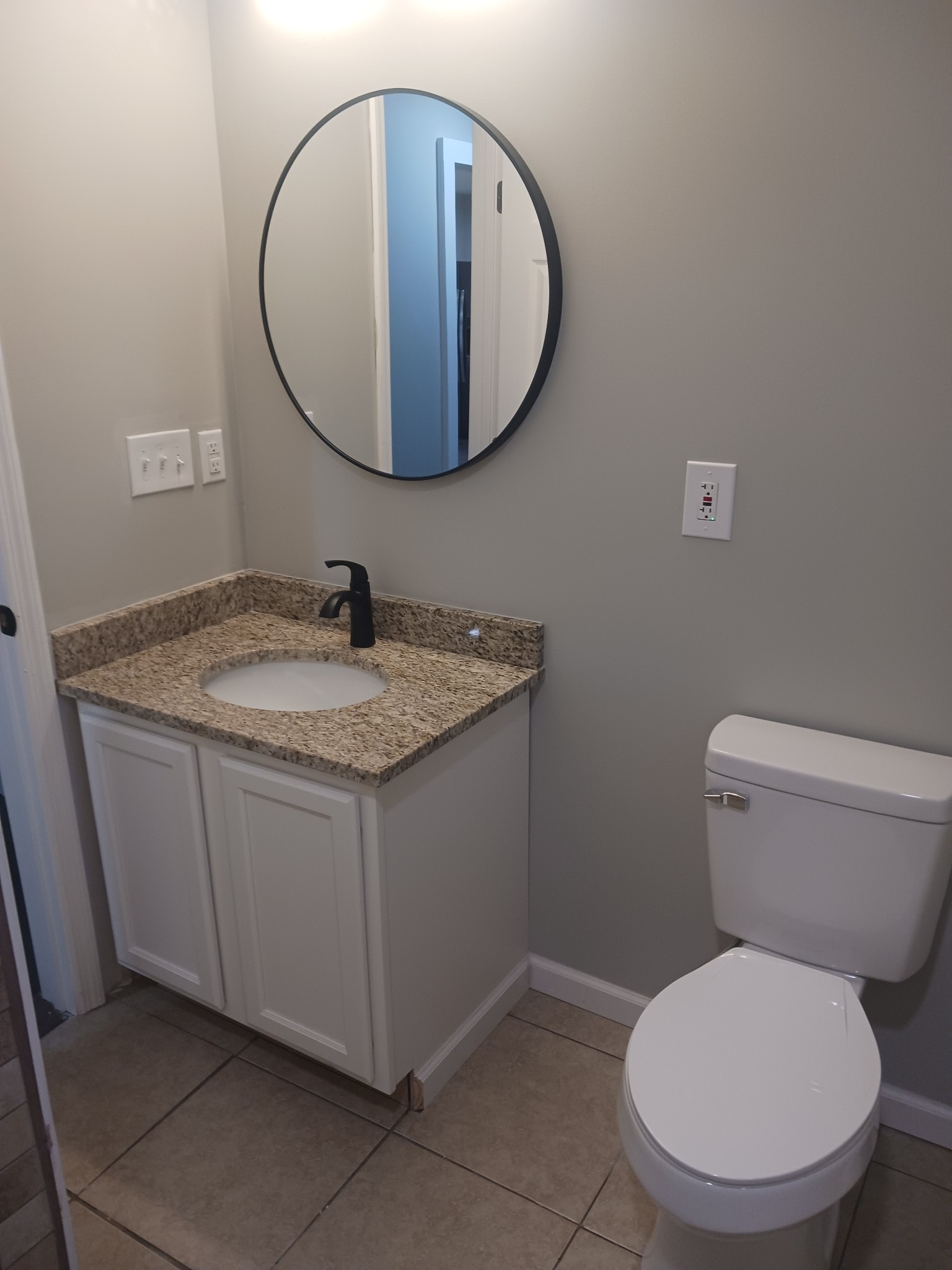 1263 Avondale Road, Unit STE B Hendersonville, TN 37075 - Photo 6 of 12 a bathroom with a granite countertop toilet a sink and mirror