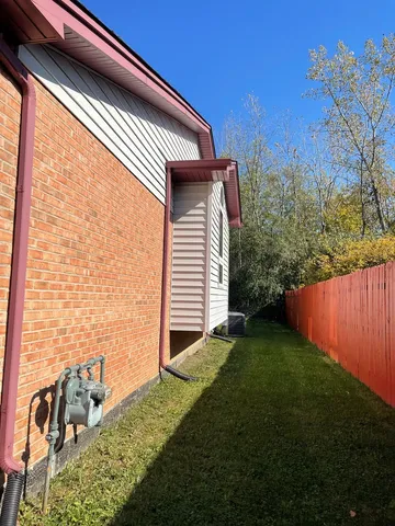 a backyard of a house with lots of green space