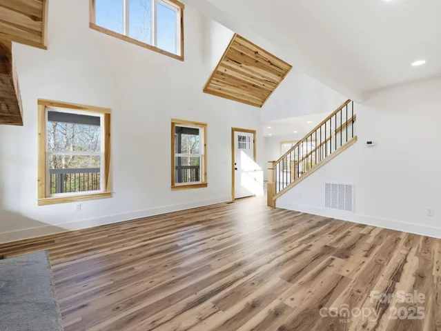 a view of an entryway with wooden floor