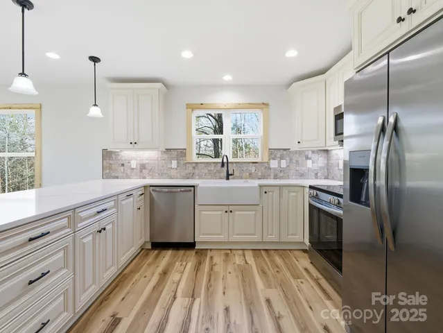 a kitchen with a sink stove and refrigerator