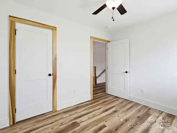 a view of balcony with wooden floor