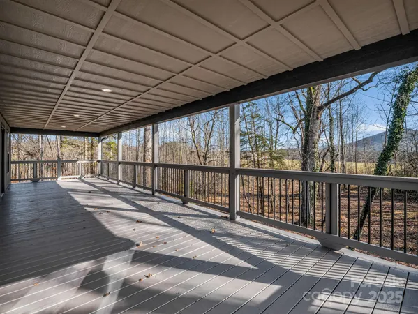 a view of outdoor space with wooden floor