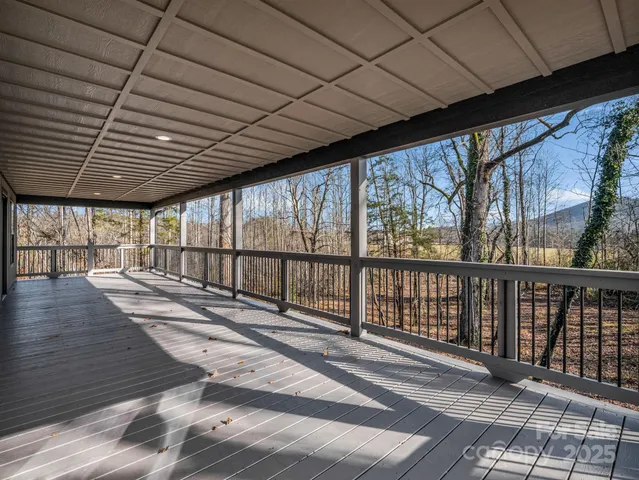 a view of outdoor space with wooden floor