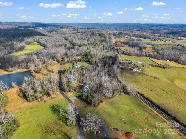 a view of a swimming pool with a lake and mountain view
