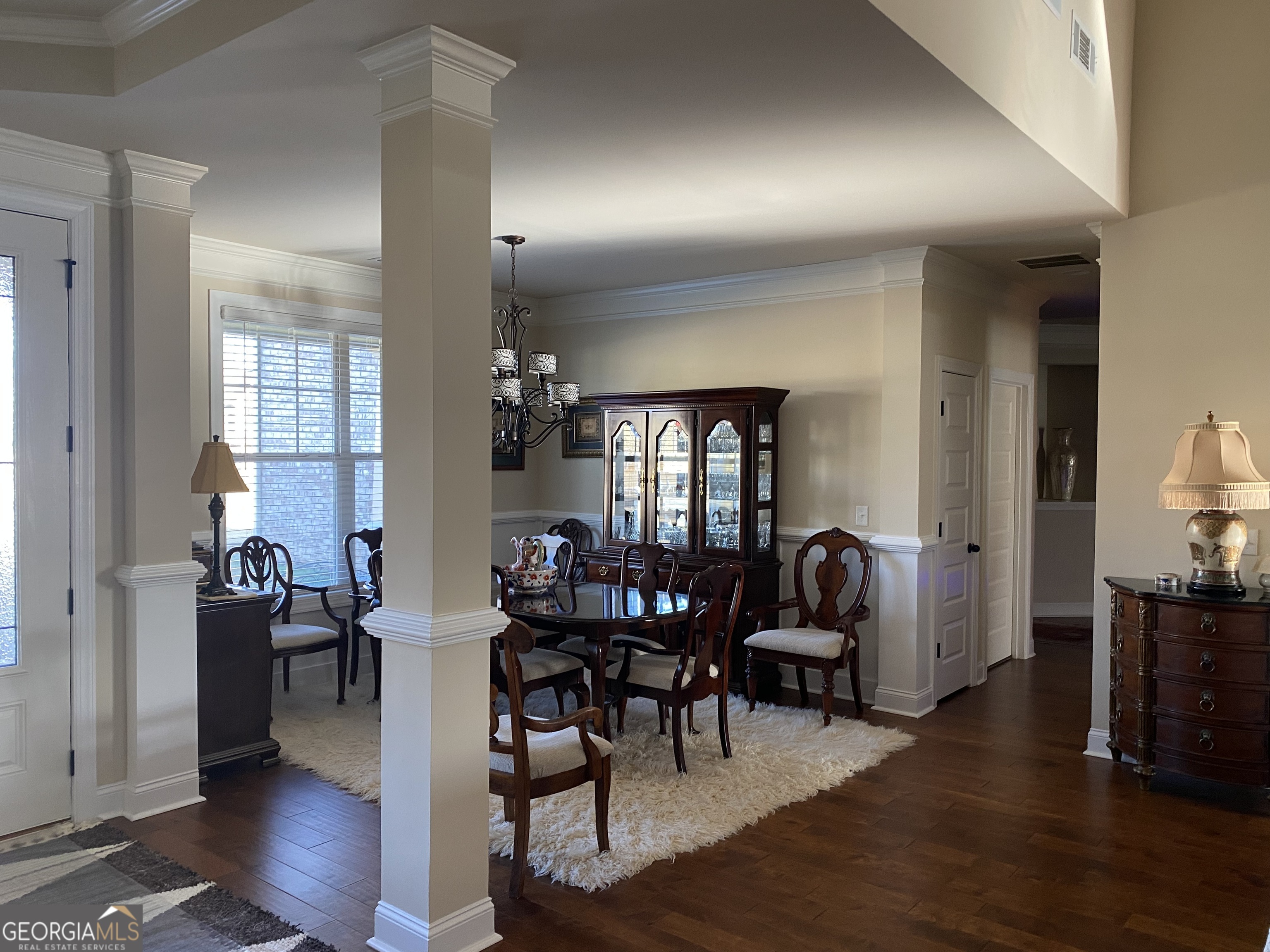 156 Elkins Boulevard Locust Grove, GA 30248 - Photo 12 of 36 a view of a livingroom and dining room