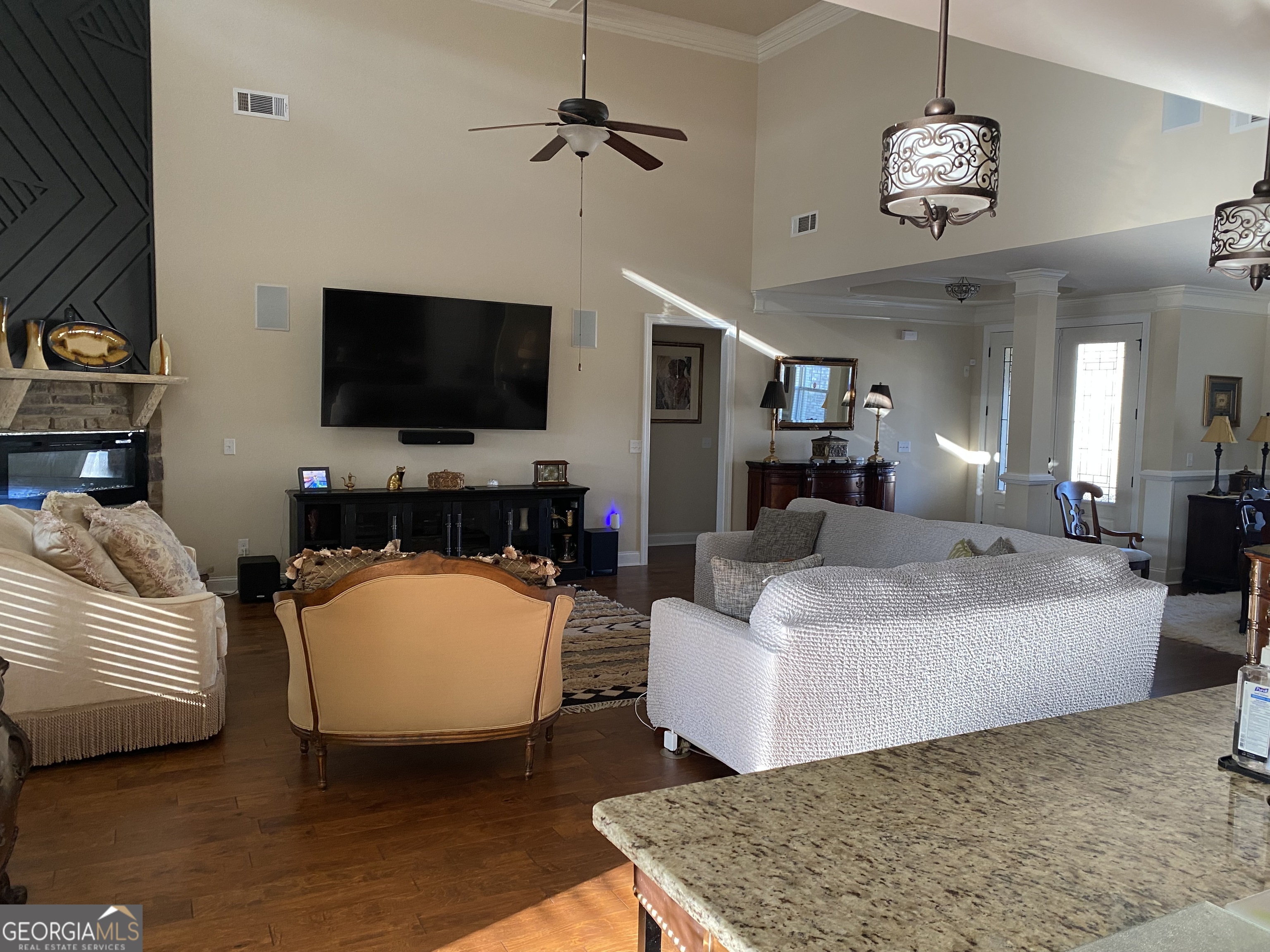 156 Elkins Boulevard Locust Grove, GA 30248 - Photo 14 of 36 a living room with furniture and a flat screen tv