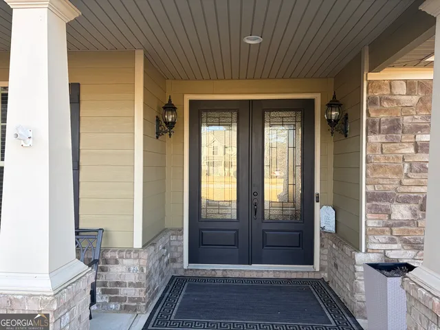 a front view of a house with garden