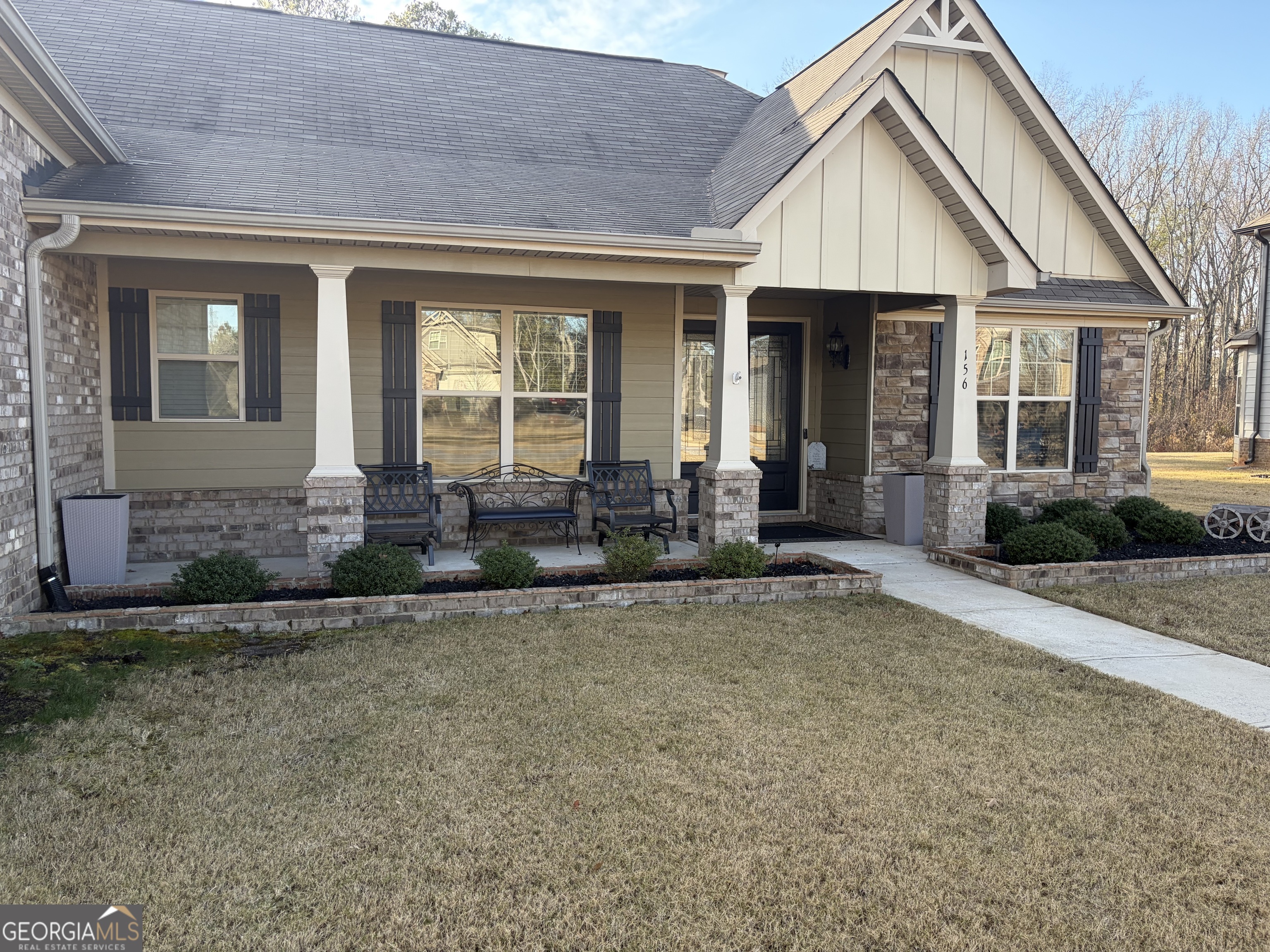156 Elkins Boulevard Locust Grove, GA 30248 - Photo 20 of 36 a front view of a house with garden