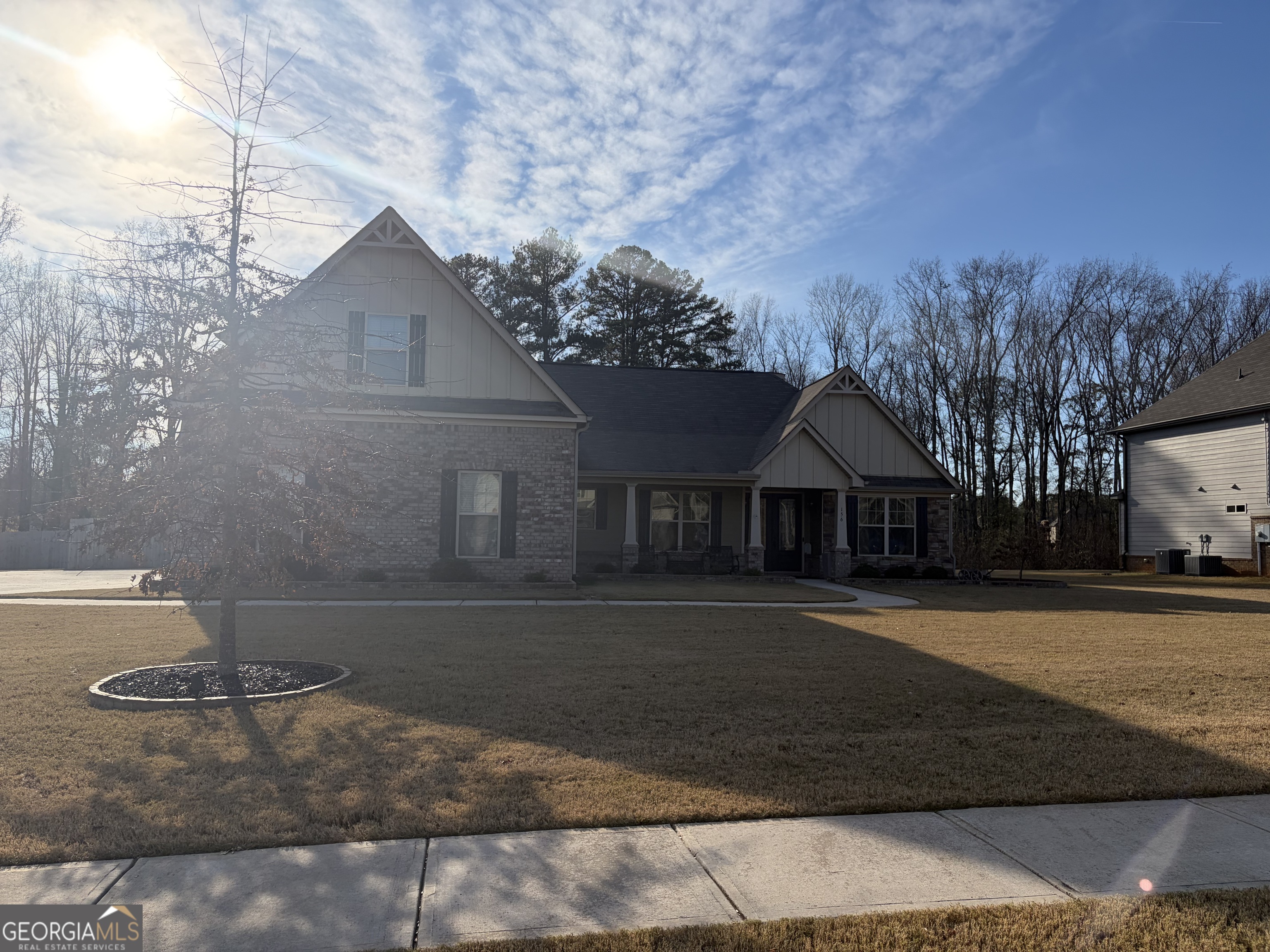 156 Elkins Boulevard Locust Grove, GA 30248 - Photo 2 of 36 a front view of a house with a yard