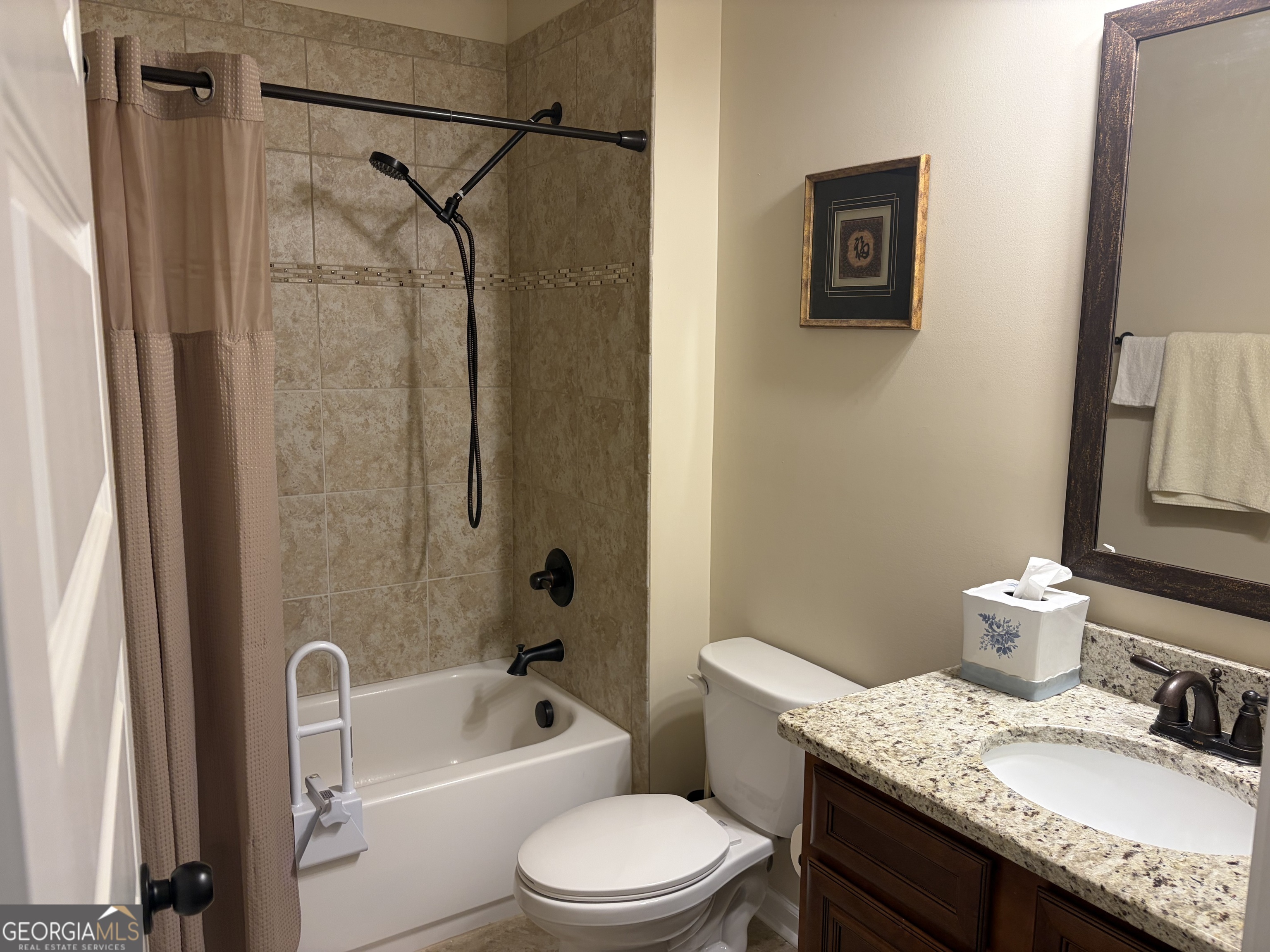 156 Elkins Boulevard Locust Grove, GA 30248 - Photo 22 of 36 a bathroom with a granite countertop sink toilet and shower