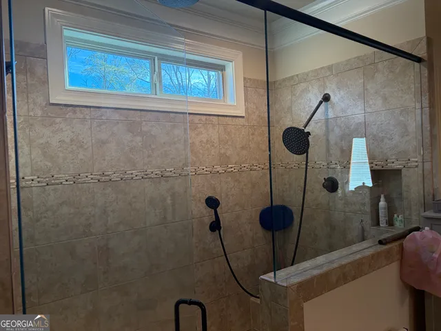 a bedroom with bed and window