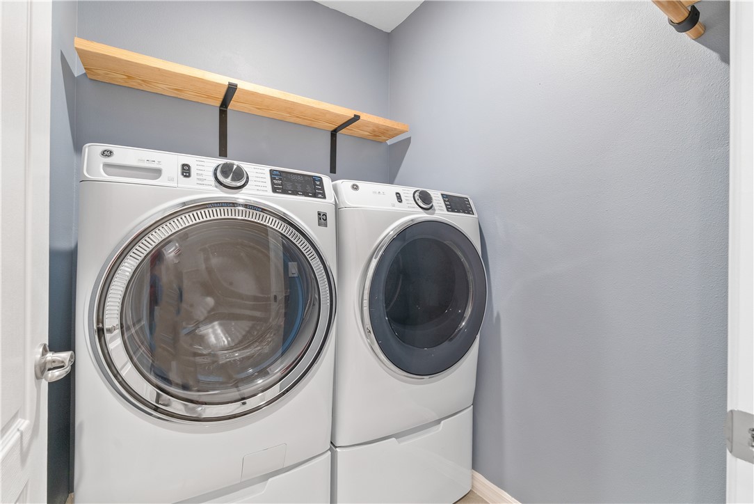 6045 Red Maple Manor Vero Beach, FL 32966 - Photo 21 of 36 a utility room with dryer and washer