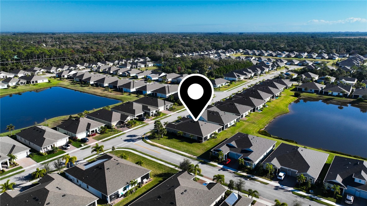 6045 Red Maple Manor Vero Beach, FL 32966 - Photo 25 of 36 an aerial view of a house with a swimming pool and outdoor space
