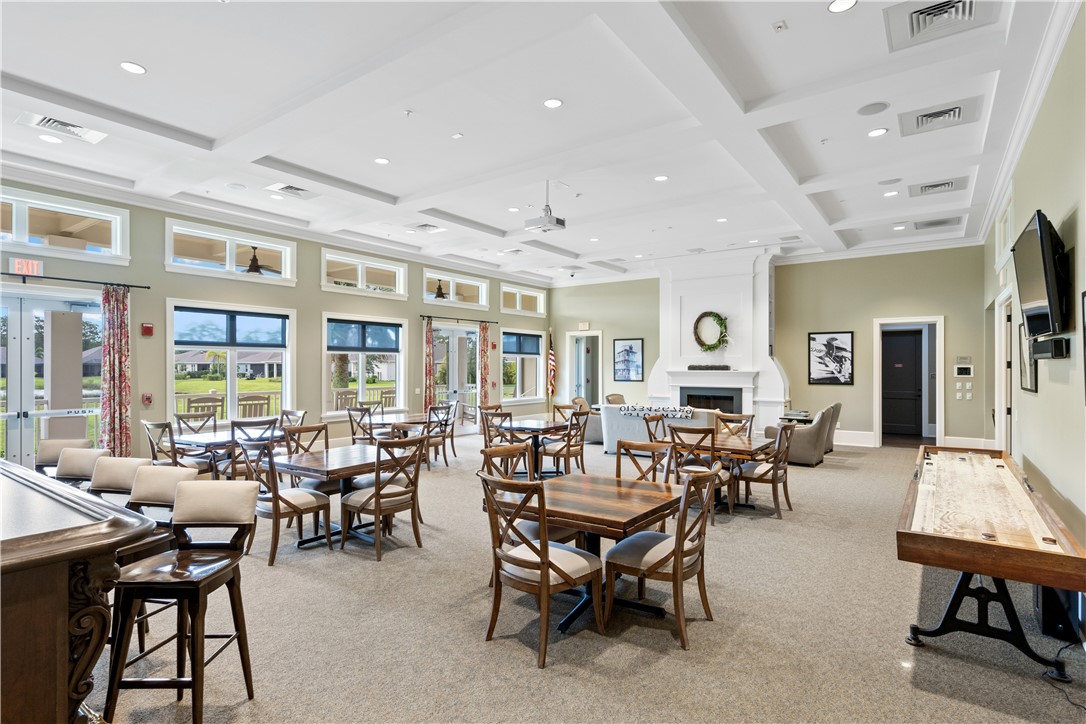 6045 Red Maple Manor Vero Beach, FL 32966 - Photo 34 of 36 a living room with furniture and a large window