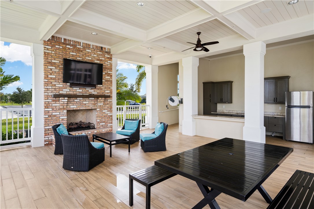 6045 Red Maple Manor Vero Beach, FL 32966 - Photo 35 of 36 a living room with furniture and a fireplace