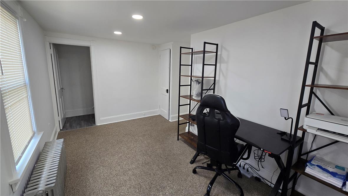 883 North Locust Street Hazleton, PA 18201 - Photo 58 of 83 An adaptable interior space featuring recessed lighting, plush carpeting, and a sun-filled window.