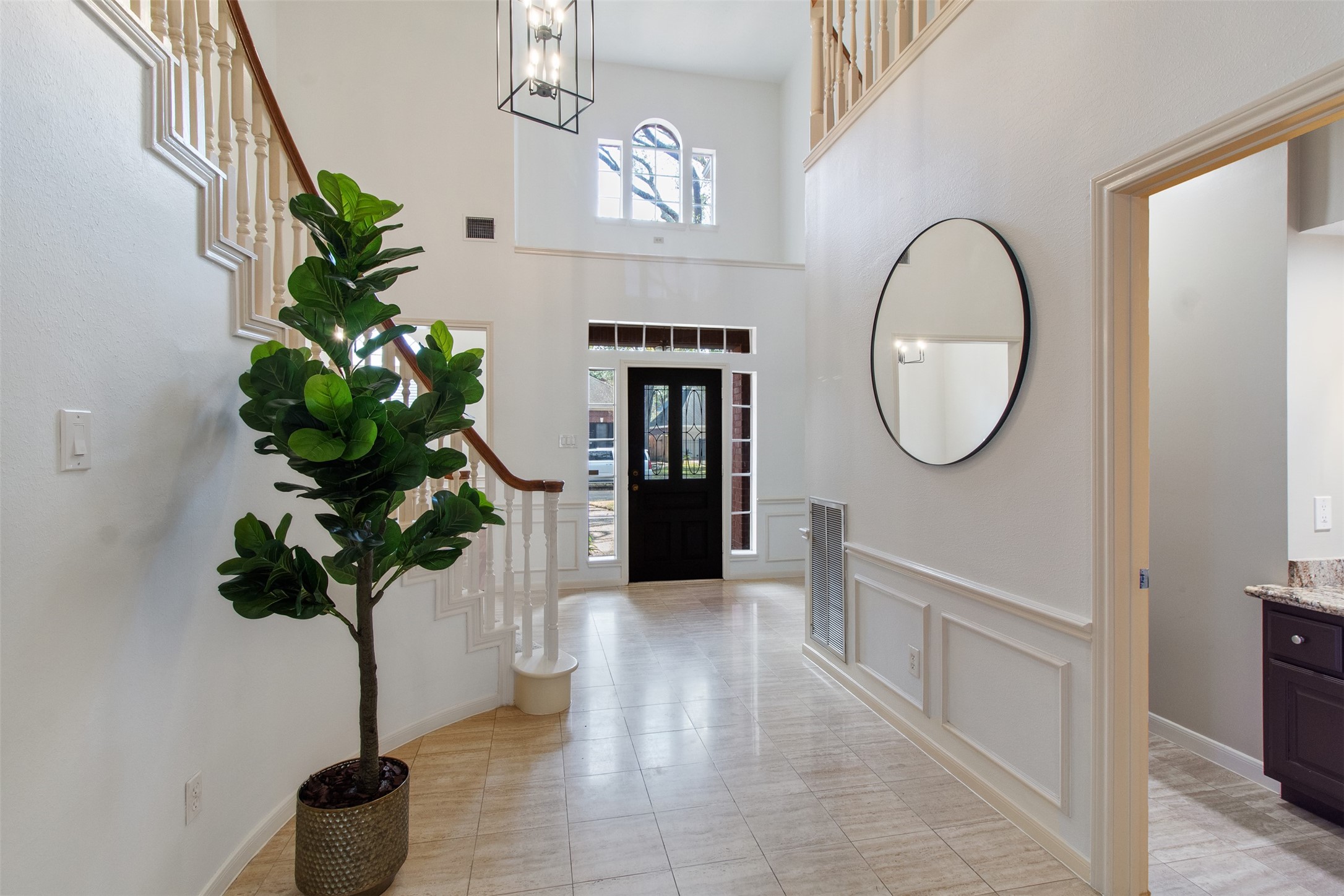 5127 Heathfield Court Houston, TX 77084 - Photo 8 of 37 Tall ceilings, natural light and tile floors elevate this foyer as you walk in.