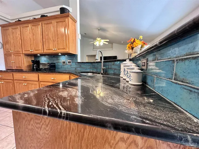 a kitchen with a sink and a counter top space