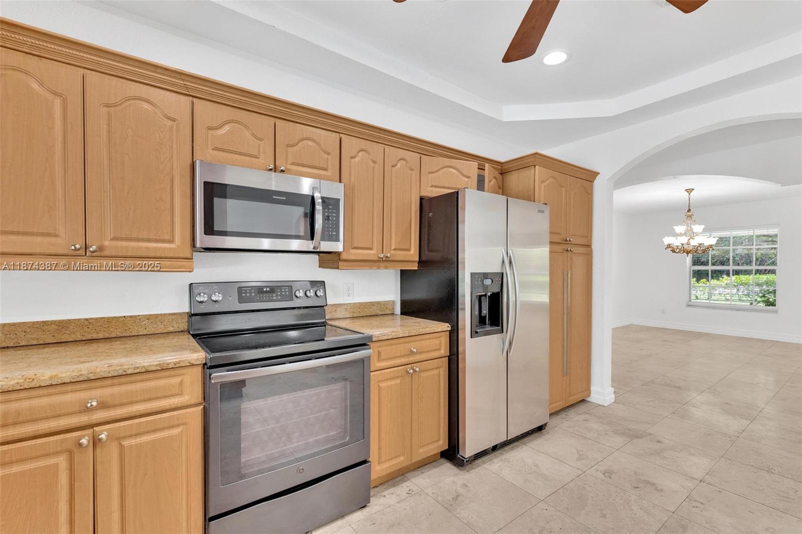 14780 Old Cutler Road, Unit 14780 Palmetto Bay, FL 33158 - Photo 12 of 16 a kitchen with a refrigerator stove and microwave