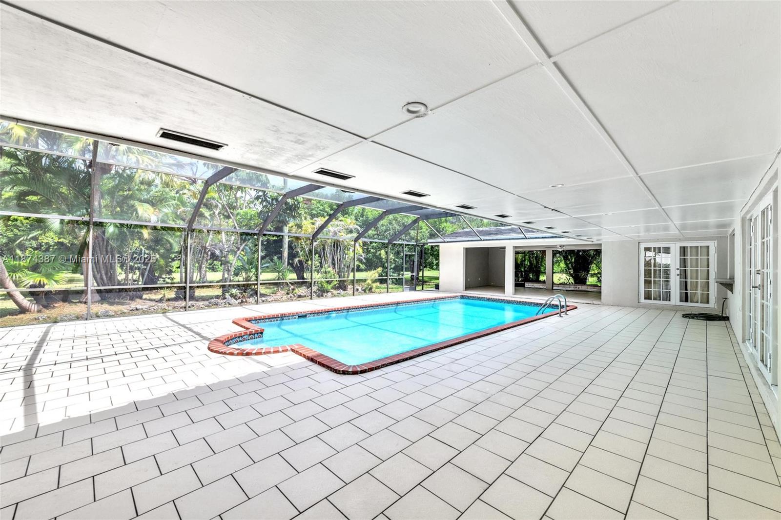 14780 Old Cutler Road, Unit 14780 Palmetto Bay, FL 33158 - Photo 14 of 16 a swimming pool with yard