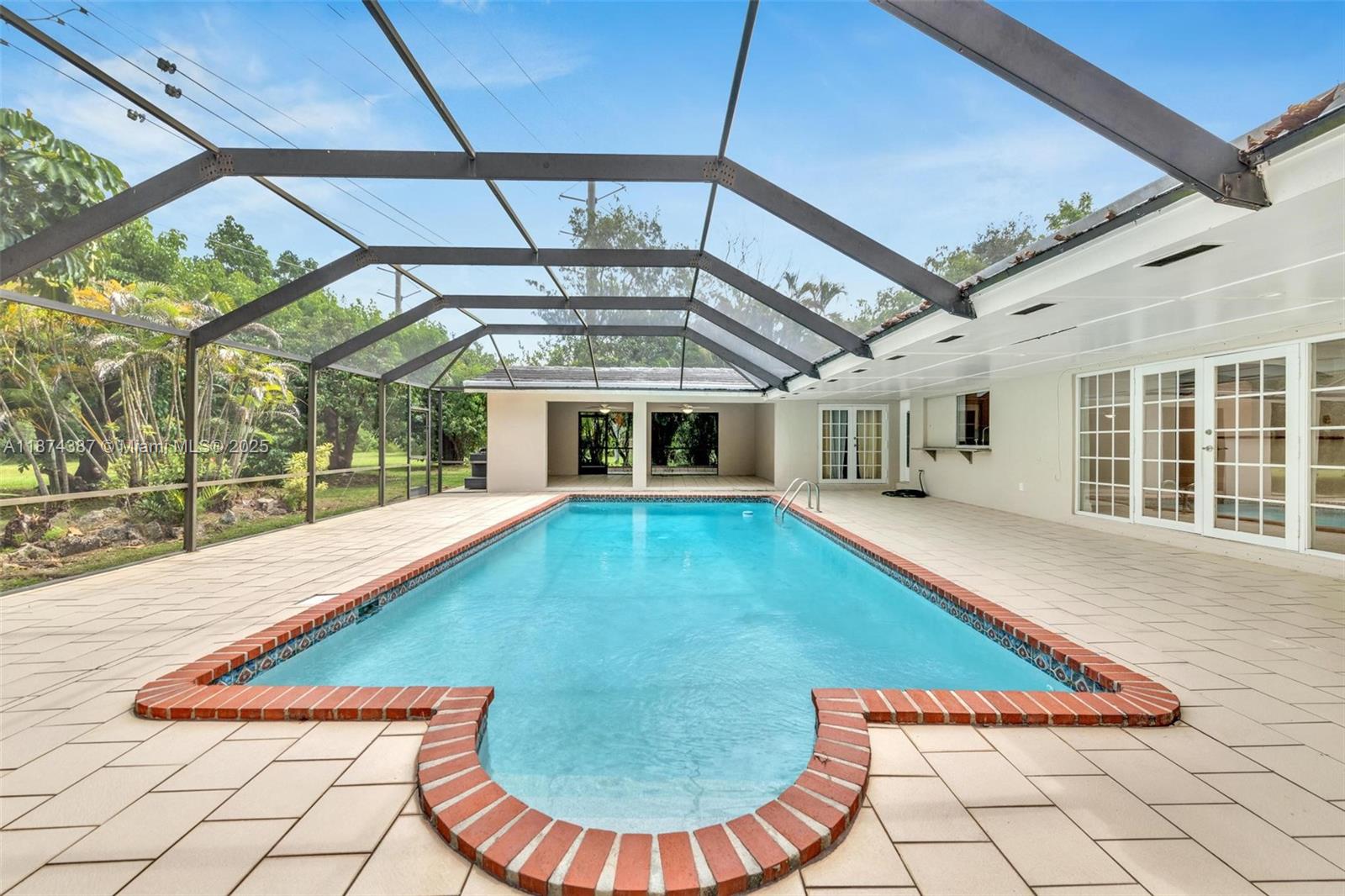 14780 Old Cutler Road, Unit 14780 Palmetto Bay, FL 33158 - Photo 15 of 16 a view of swimming pool with a lounge chair