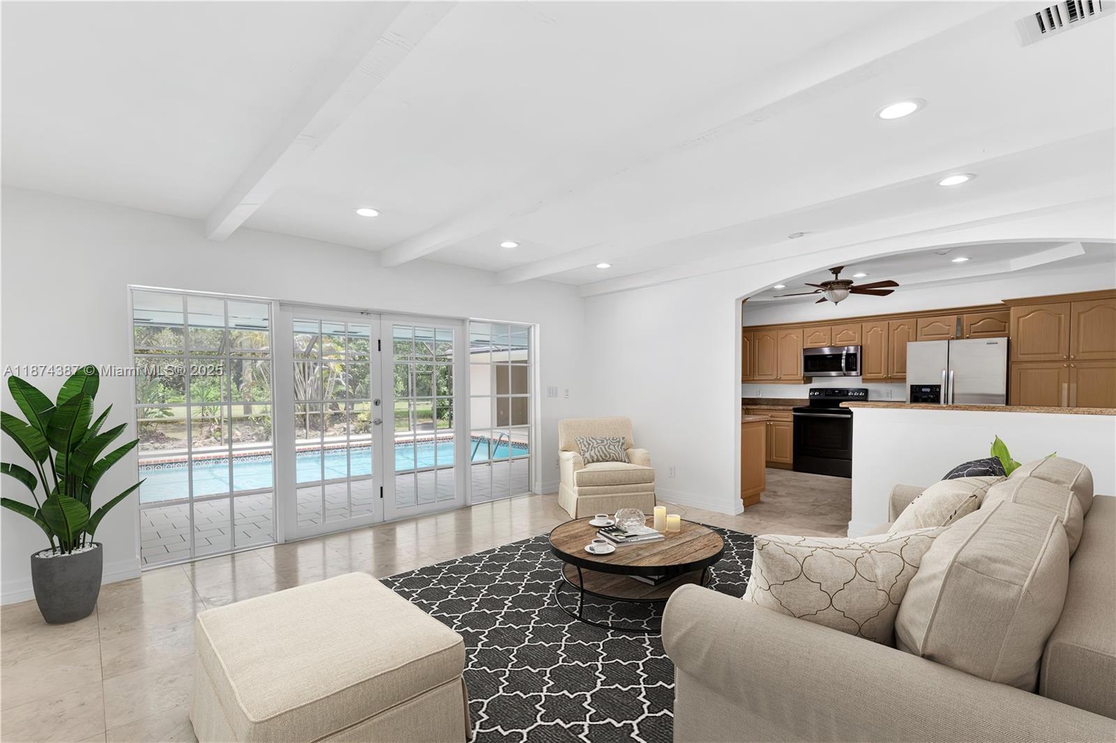 14780 Old Cutler Road, Unit 14780 Palmetto Bay, FL 33158 - Photo 6 of 16 a living room with furniture and a large window