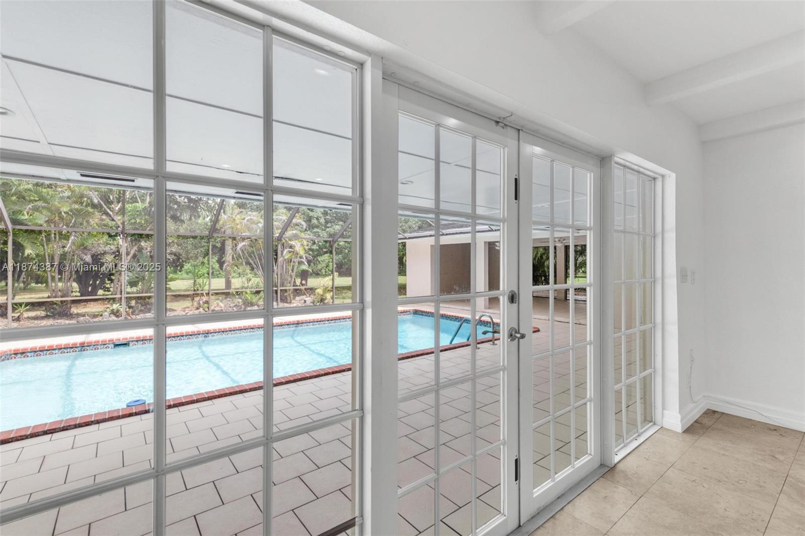 14780 Old Cutler Road, Unit 14780 Palmetto Bay, FL 33158 - Photo 7 of 16 a view of a livingroom with a furniture and floor to ceiling window