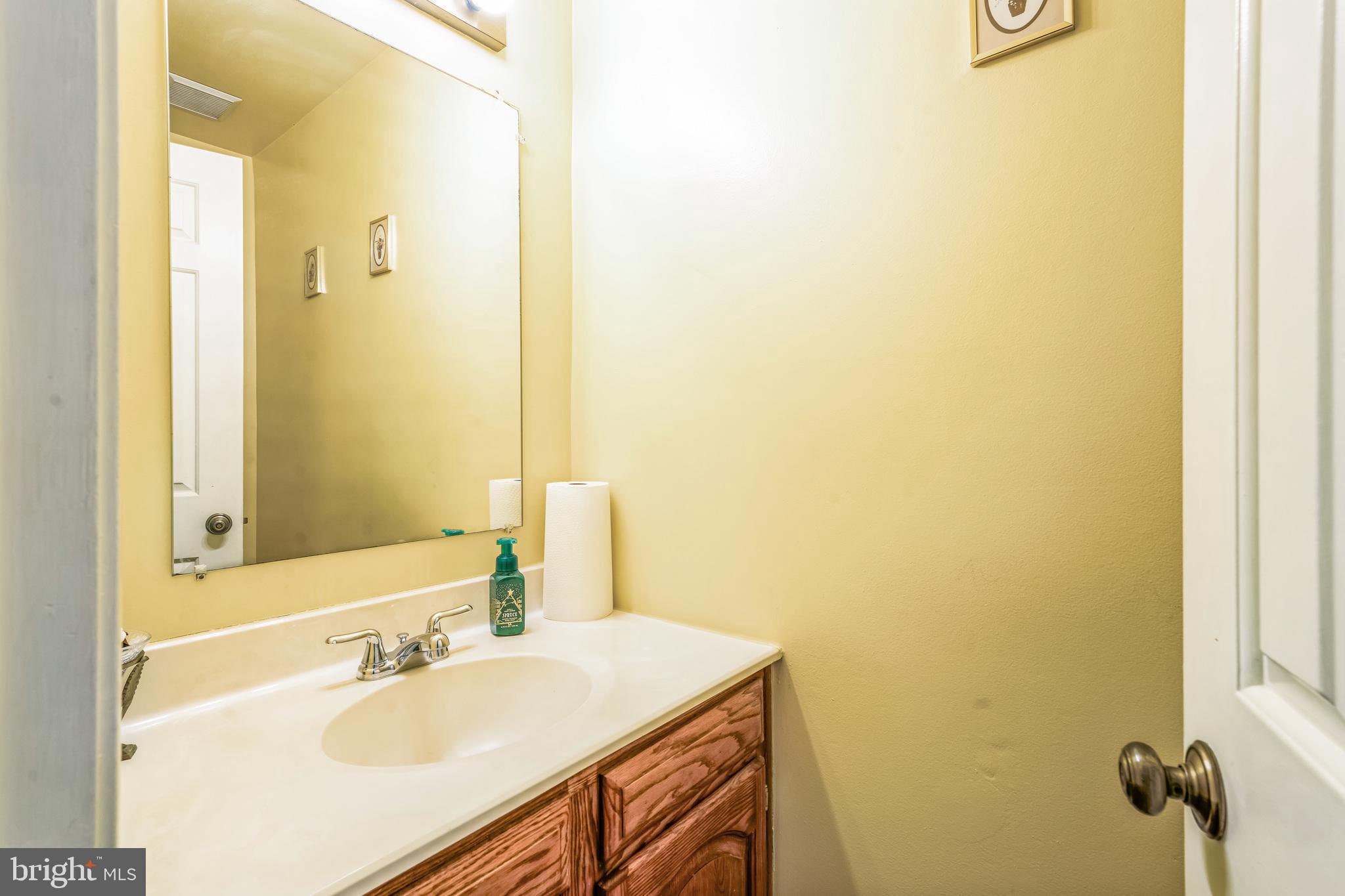 10401 Cleary Lane Bowie, MD 20721 - Photo 13 of 30 a bathroom with a sink and a mirror
