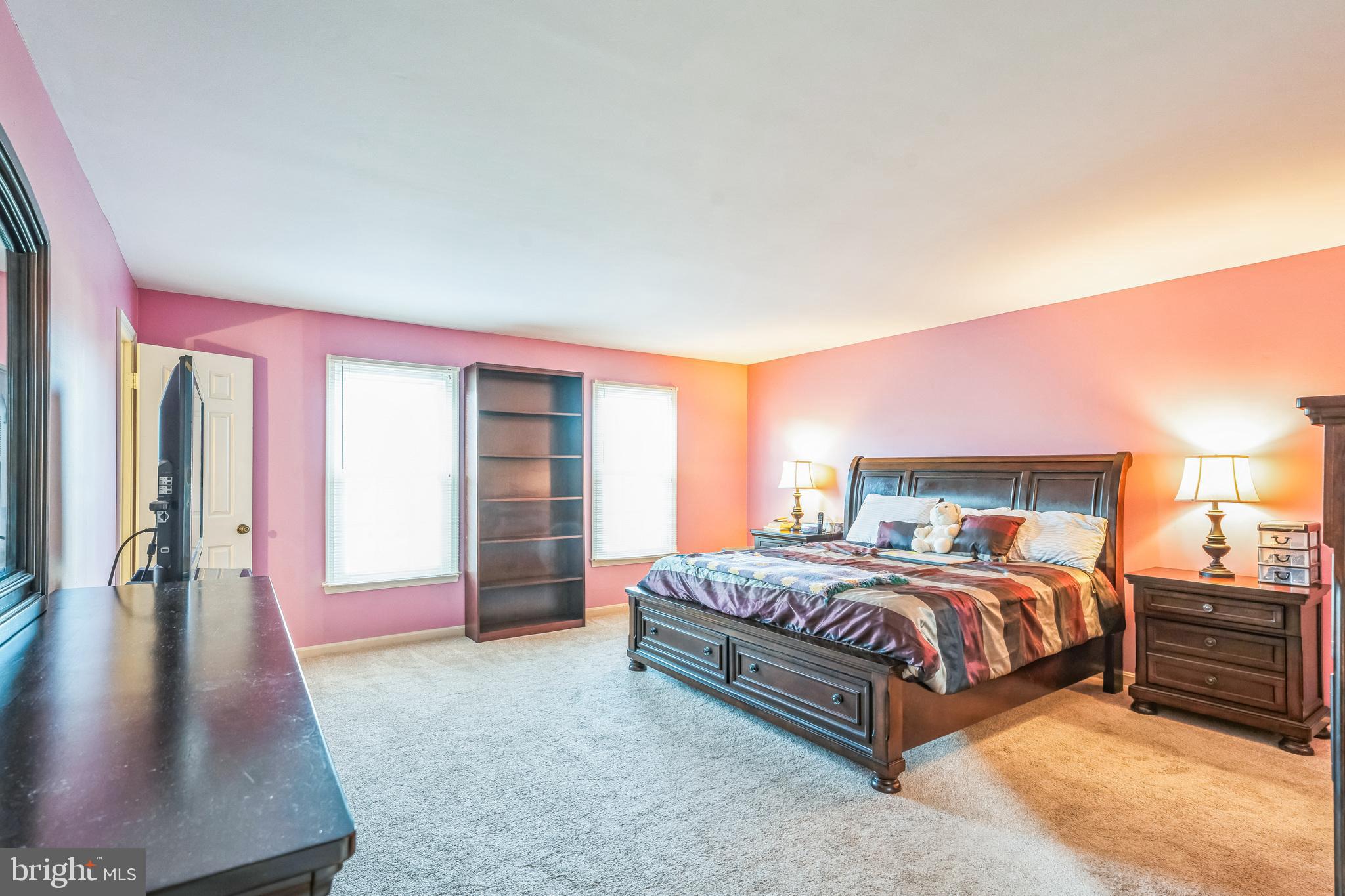 10401 Cleary Lane Bowie, MD 20721 - Photo 15 of 30 a bedroom with a bed and a large mirror