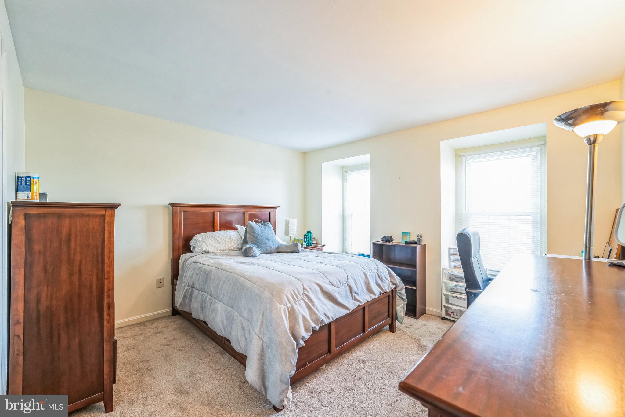 10401 Cleary Lane Bowie, MD 20721 - Photo 20 of 30 a bedroom with a bed and wooden floor