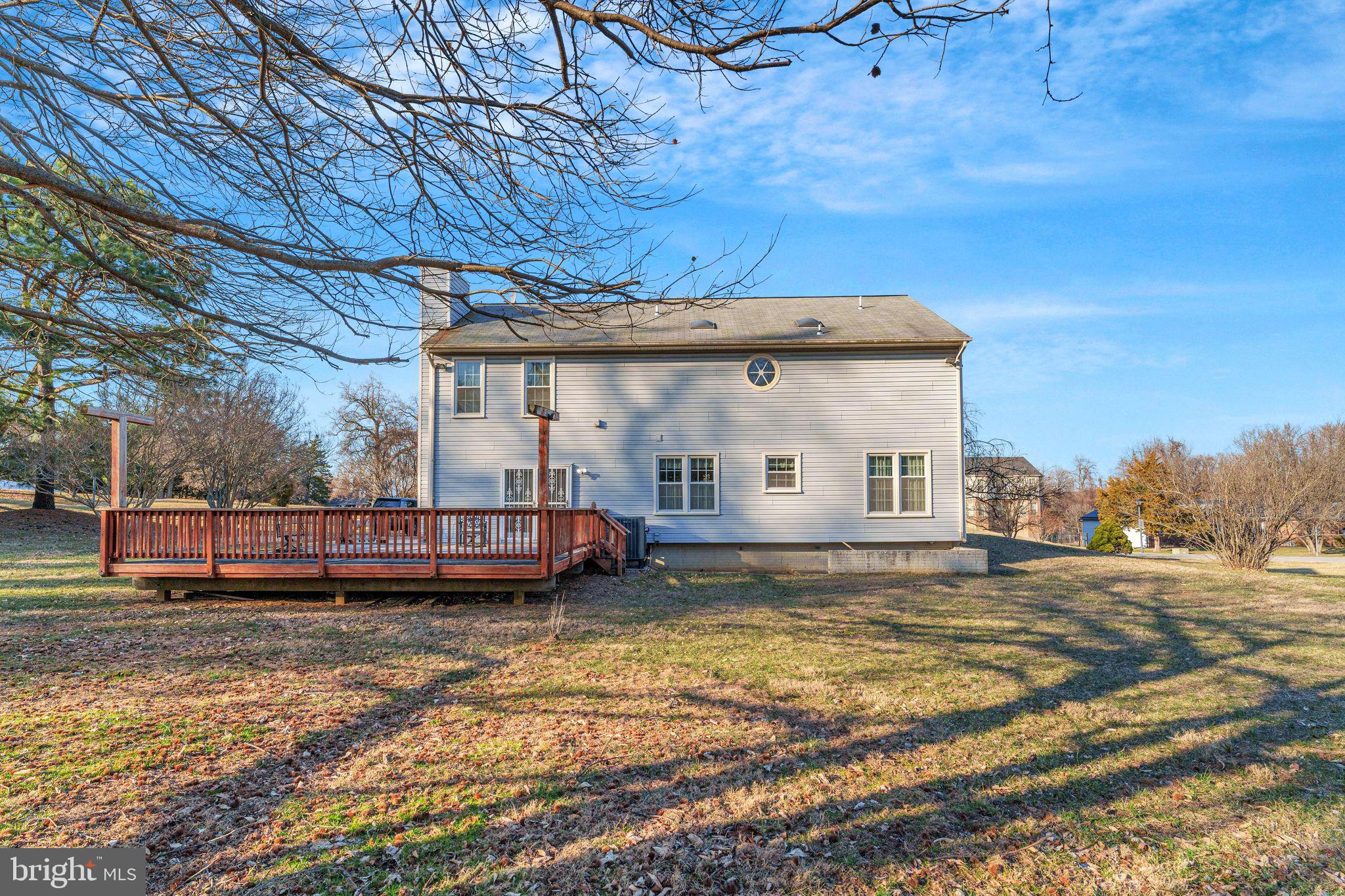 10401 Cleary Lane Bowie, MD 20721 - Photo 28 of 30 a view of a house with a bed and trees