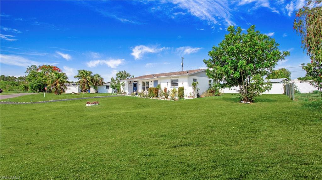 515 York Road Lehigh Acres, FL 33936 - Photo 16 of 22 a view of a house with a backyard