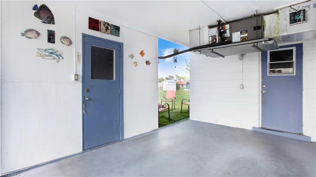 515 York Road Lehigh Acres, FL 33936 - Photo 3 of 22 a view of a hallway with entryway and furniture