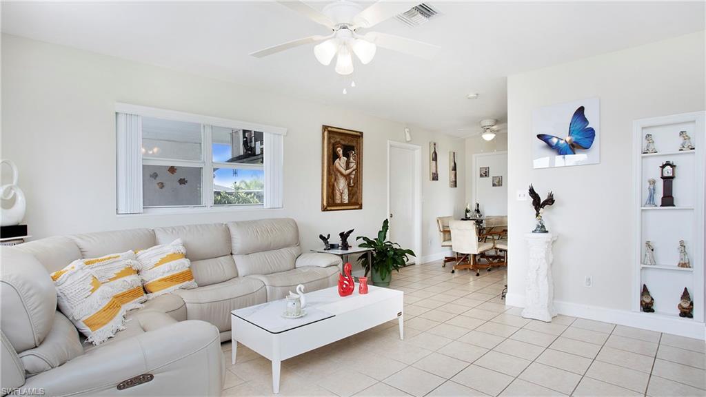 515 York Road Lehigh Acres, FL 33936 - Photo 7 of 22 a living room with furniture and white walls