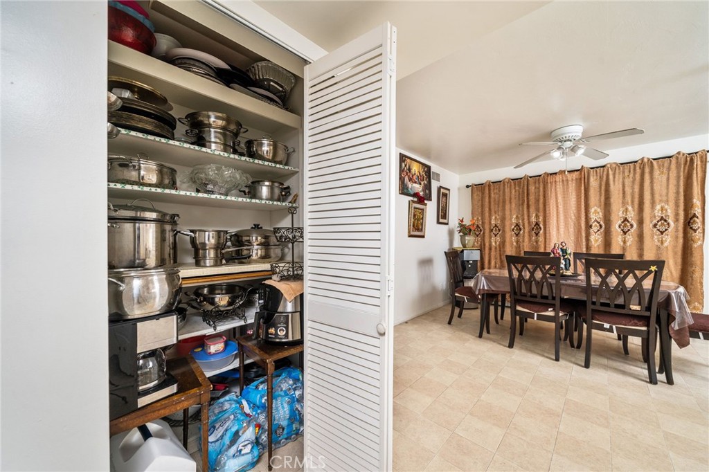 5035 Carlingford Avenue Riverside, CA 92504 - Photo 14 of 32 a dining room with furniture and a book shelf
