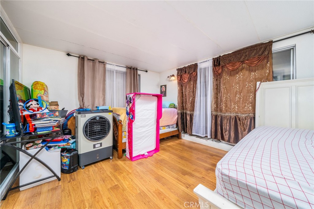 5035 Carlingford Avenue Riverside, CA 92504 - Photo 16 of 32 a view of a bedroom with a bed and toys