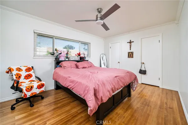 a bed room with a bed and a chair